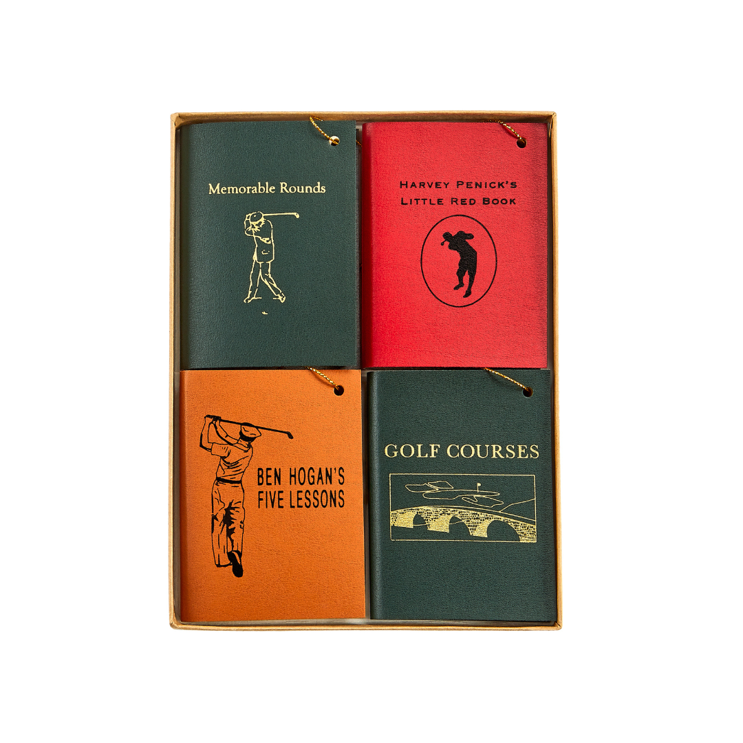 Front view of Mini Leather Ornaments: The Golfer showcasing four colorful embossed leather golf designs in a box