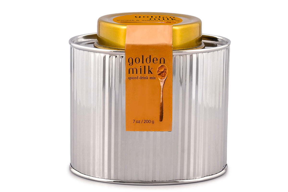 Front view of Golden Milk Spice Mix in a reusable metal tin labeled 7 ounces and 200 grams on a white background