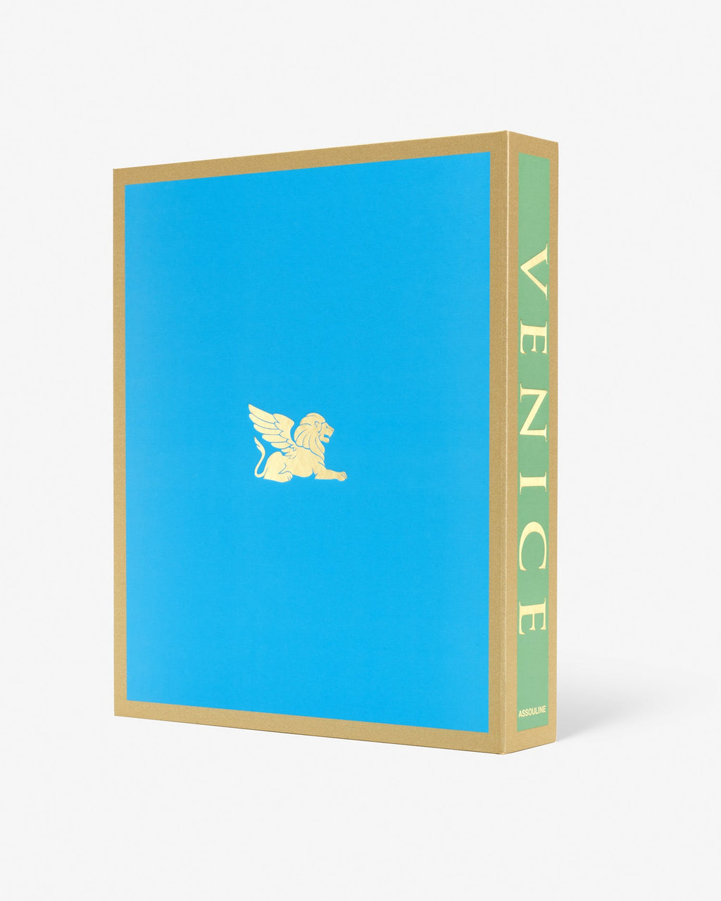Venice: La Serenissima by Assouline: Three-quarter view of the back face and spine of the clamshell box. The back is solid sky blue with a small gold winged lion of Saint Mark emblem centered. The spine reads VENICE vertically on a green ground. Gold trim frames the box edges.