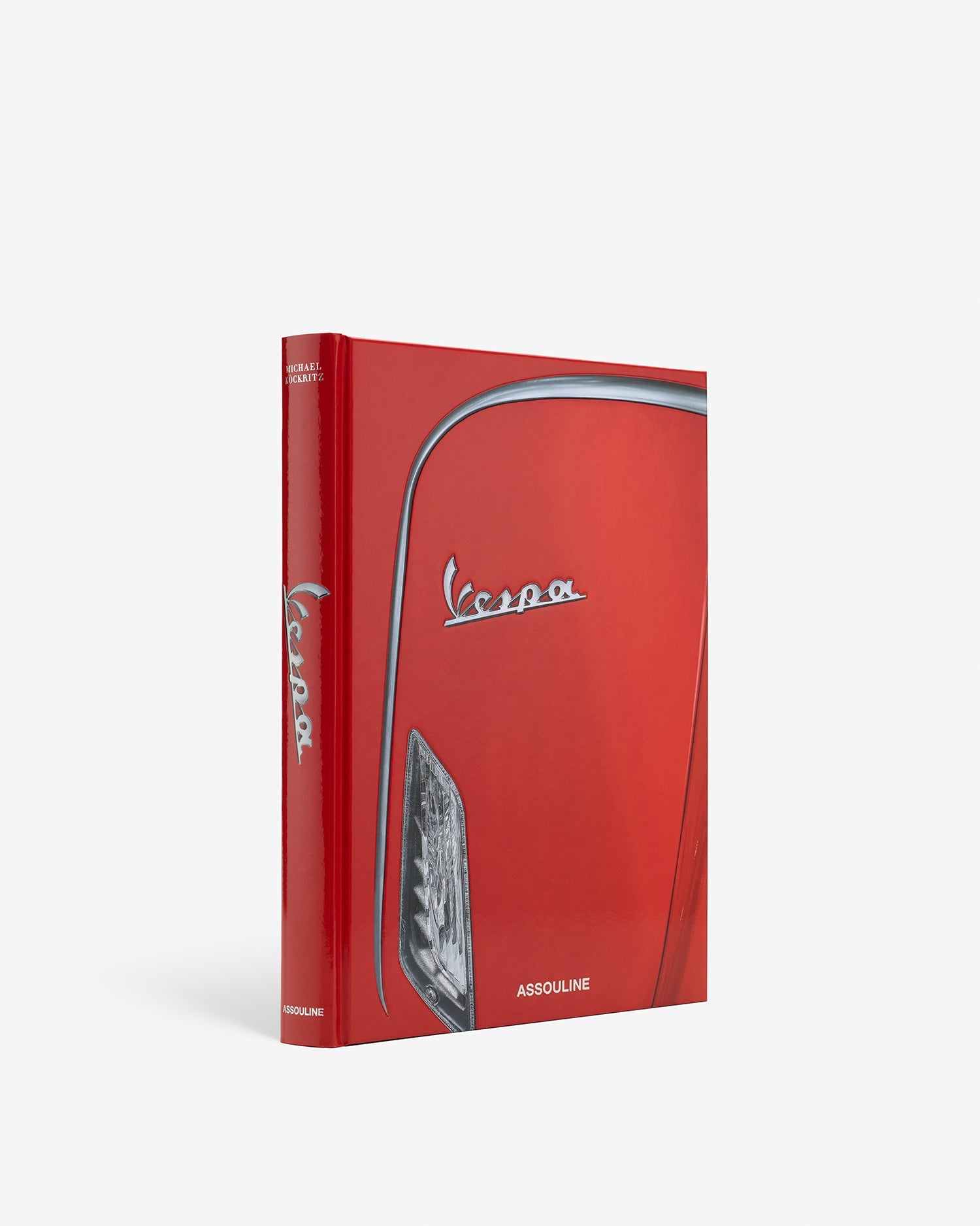 Red book with Vespa logo on a white background