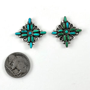 Front view of Pretty Vintage Petit Point Earrings showcasing turquoise and green floral designs with a coin for scale