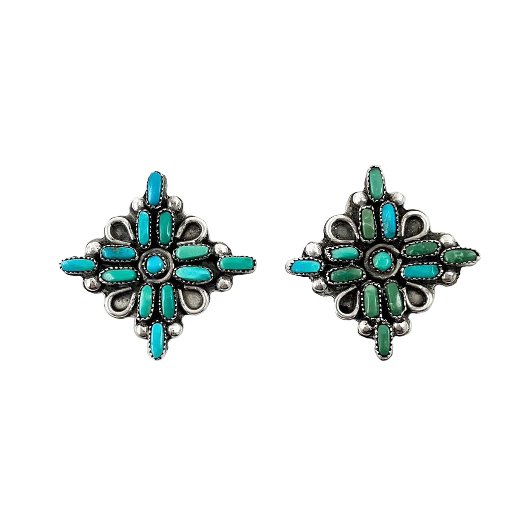 Front view of vintage petit point earrings showcasing turquoise and green geometric designs with white background