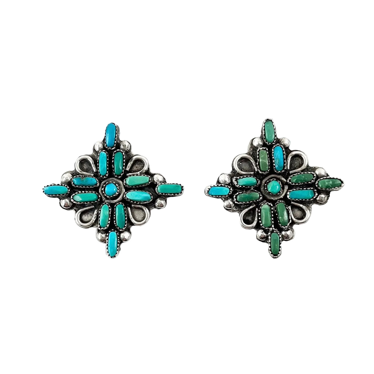Front view of vintage petit point earrings showcasing turquoise and green geometric designs with white background