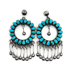 Front view of vintage hoop earrings showcasing American turquoise stones, sterling silver and dangling star studs on white background