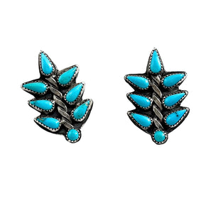 Front view of small turquoise leaf stud earrings showcasing sterling silver and Sleeping Beauty turquoise with white background