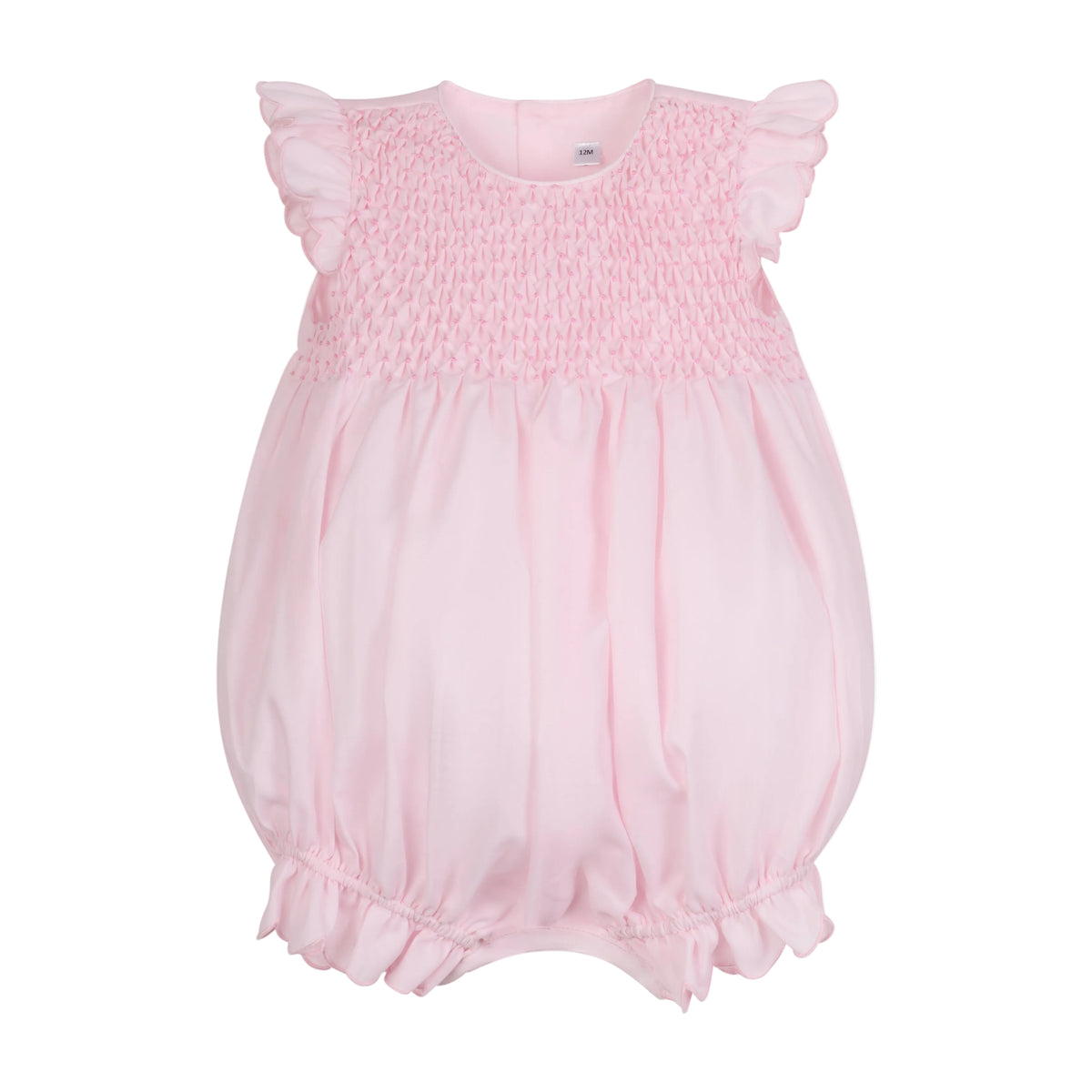 Front view of Constantina Bubble romper in pink poplin with smocked bodice, ruffled sleeves, and gathered hem on white