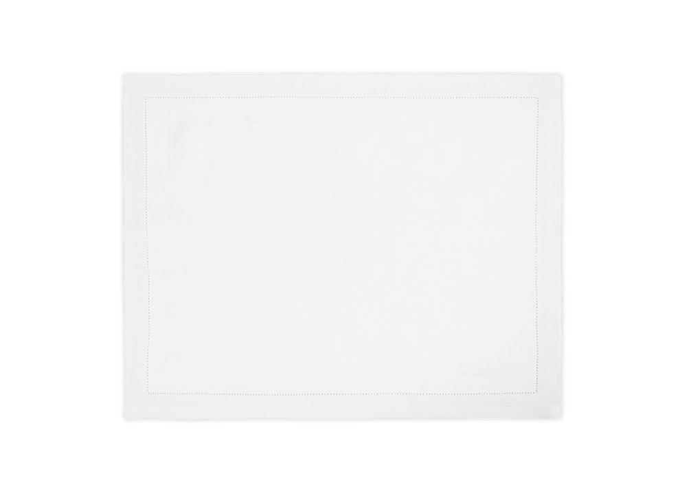 Top view of a white Valentina Hemstitch placemat showcasing its intricate hemstitch border against a black background