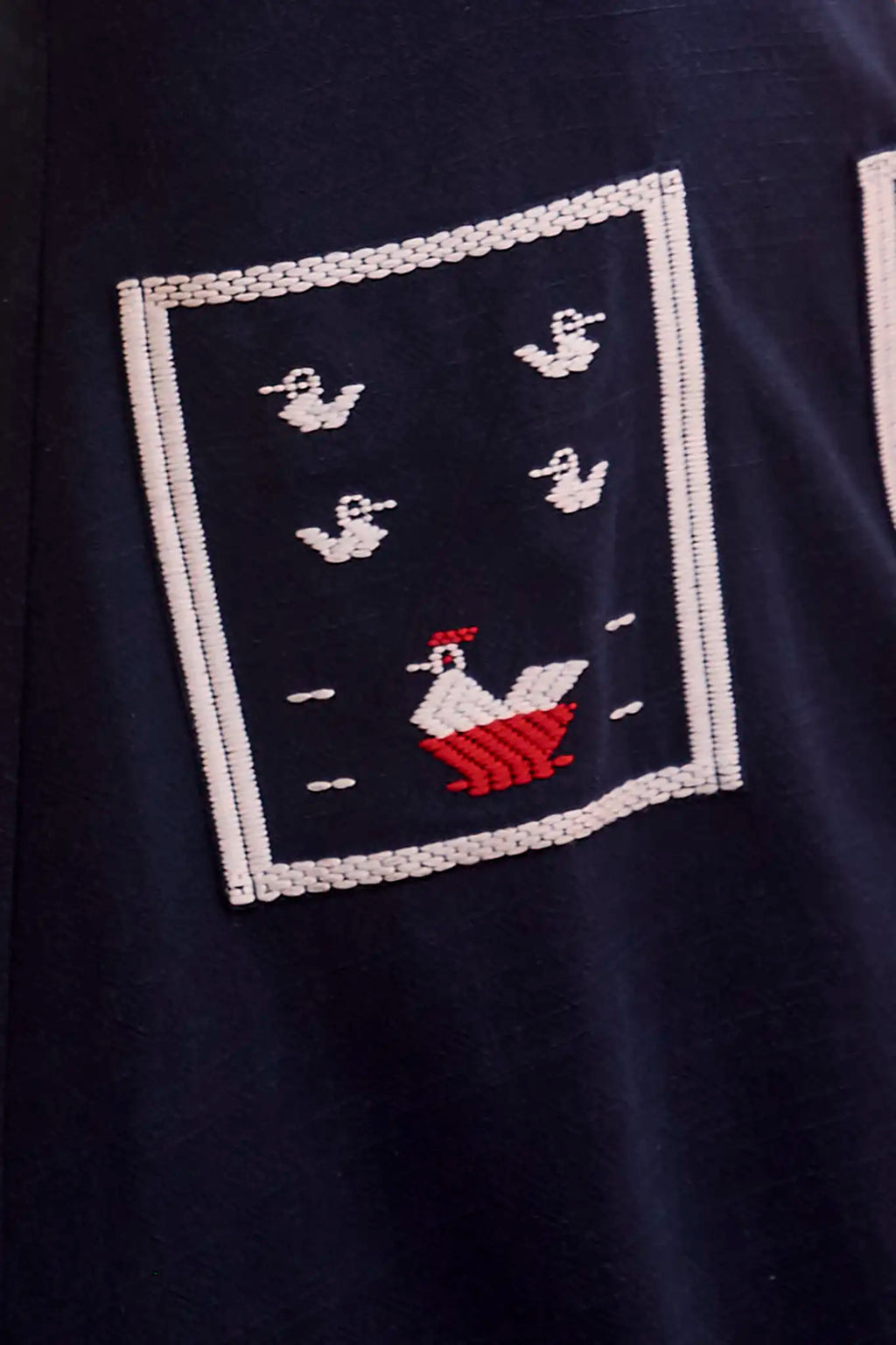 Close up of The Vaughn Dress in Deep Sea. 