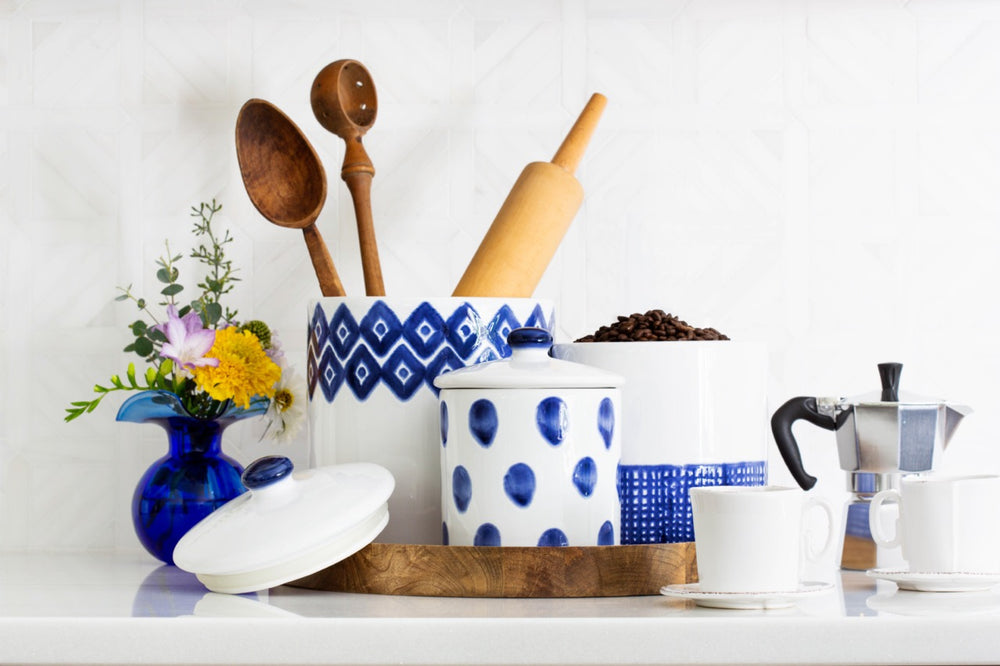 Santorini canister set of blue-and-white hand-painted ceramic canisters with polka dots and geometric trim in a kitchen scene