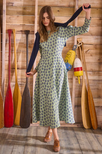 Midi dress with a clean crew neckline, modern dolman sleeves, with a circle-cut skirt.