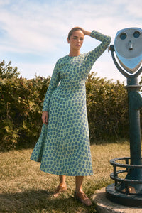 Midi dress with a clean crew neckline, modern dolman sleeves, with a circle-cut skirt.