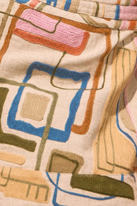 Skirt with a banded waist and sleek wrap silhouette with discreet snap closure.