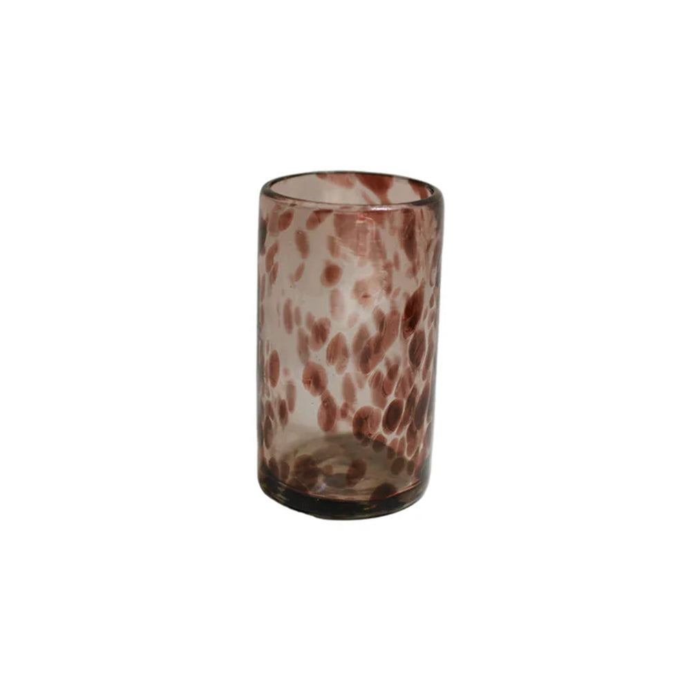 Front view of amethyst marbled glass votive showing elongated cylindrical silhouette and mauve spotted pattern on white background