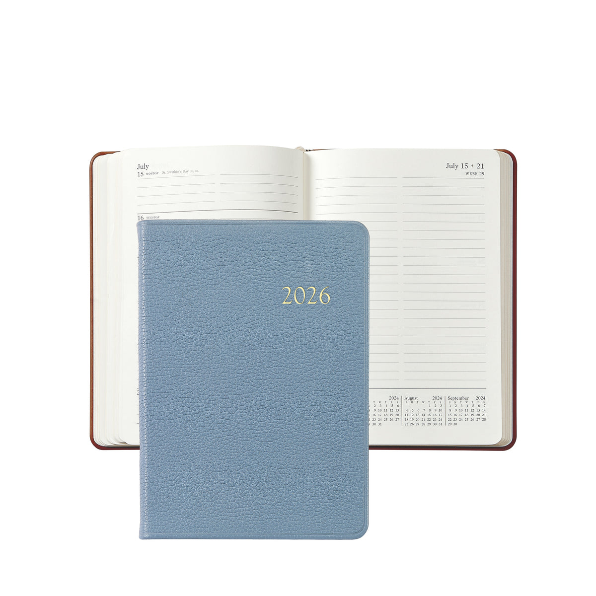 Front view of 2026 Weekly Notebook in slate blue pebble leather with gold embossed 2026 and open weekly pages visible