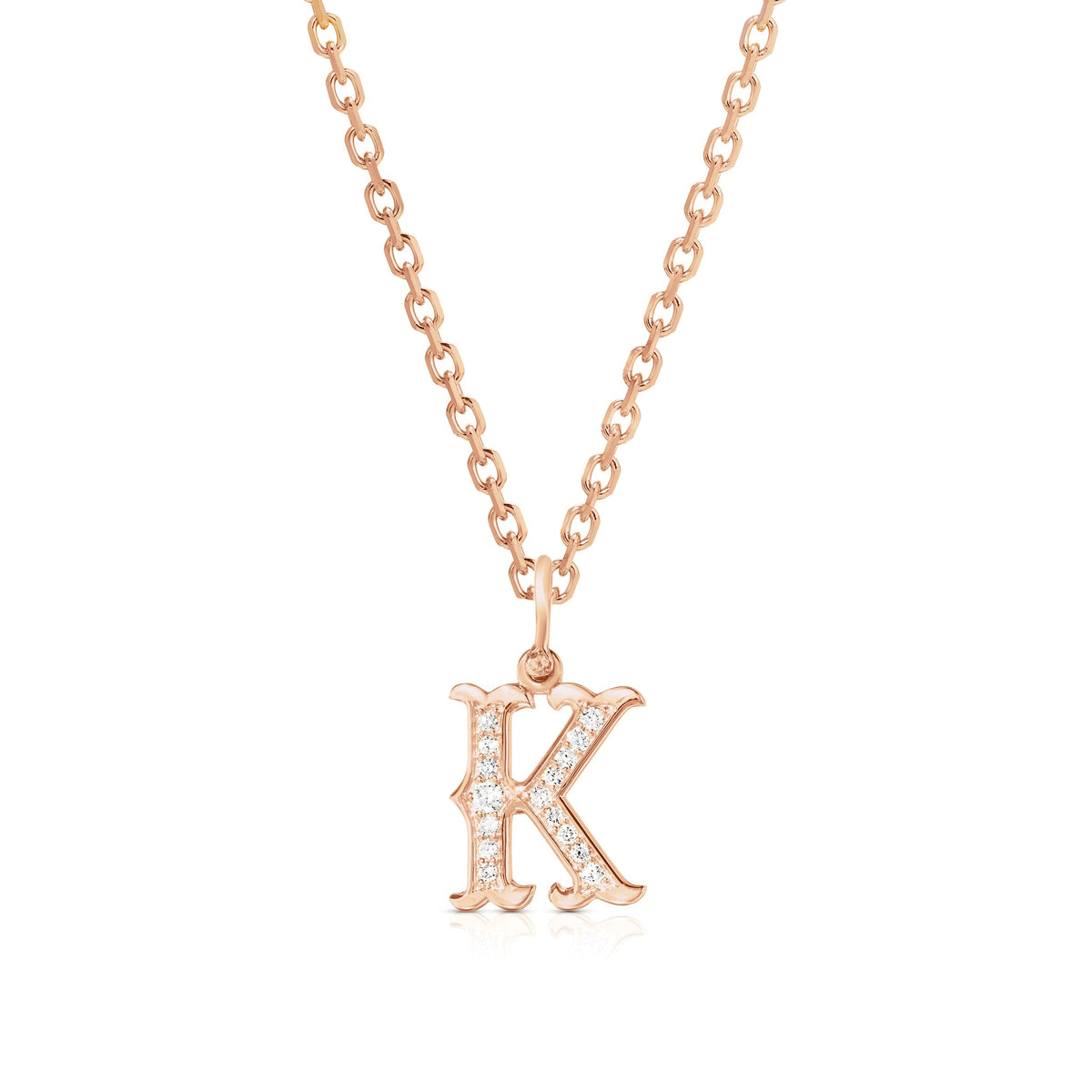 Front view of Western K initial pendant in 14k rose gold on chain with pavé diamond accents on white background