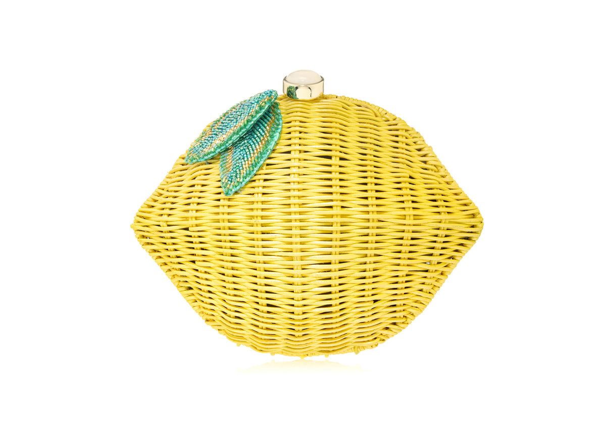 Front view of Lemon Basket Citrus Clutch showcasing woven yellow basket silhouette and beaded citrus detail on white background