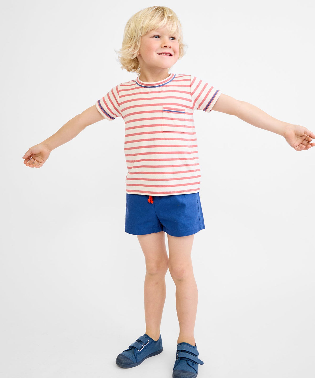 Front view of Willie T‑shirt in nautical red stripe on child model showcasing chest pocket and contrast neck and sleeve piping on white background
