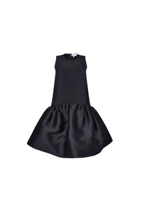 The Windsor Dress has a sleeveless silhouette with a crew neckline, dropped waist with bubble skirt.