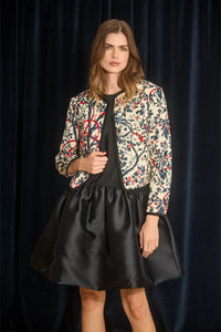 The Atwood Jacket is a quilted jacket with a crew neckline, long sleeves, and velvet ribbon trim.