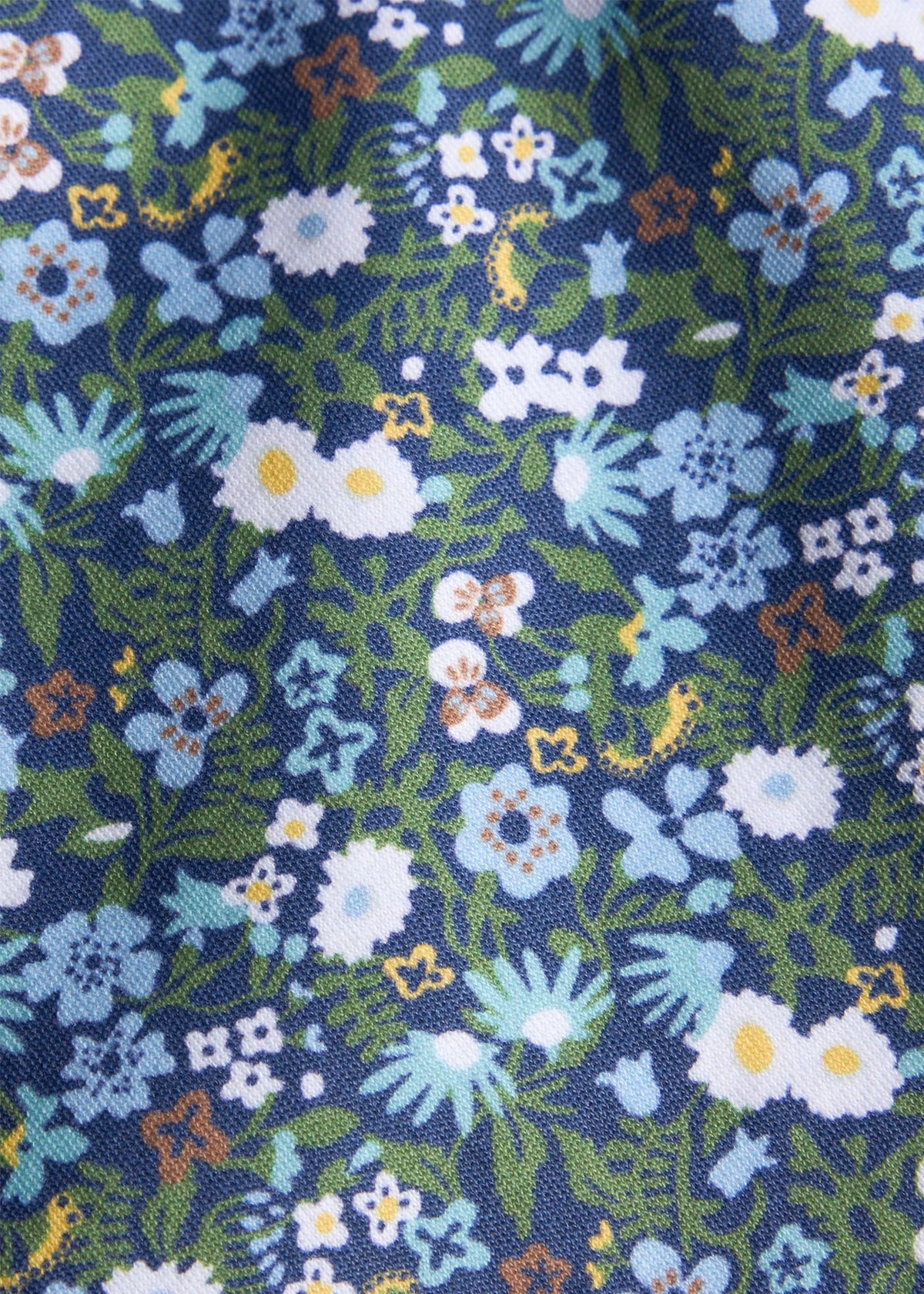 Little English traditional children's clothing. Blue, navy, and green Winslow Floral knit fabric swatch