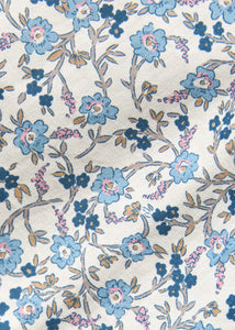 Little English traditional children's clothing. Blue, brown and cream Wisteria Floral fabric swatch