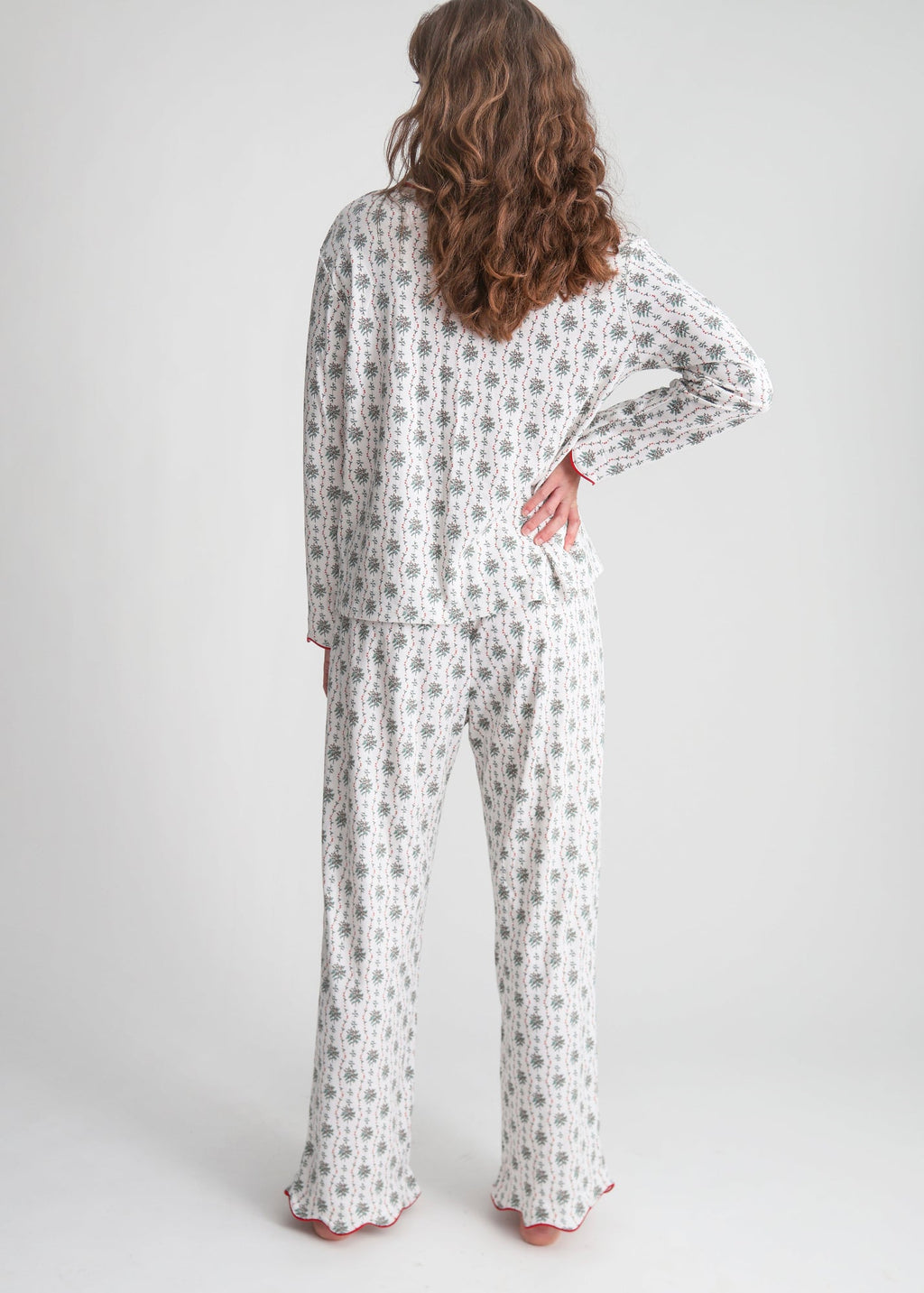 Back view of Holly women’s button front long scallop pajama set showing patterned fabric on a model in a light studio