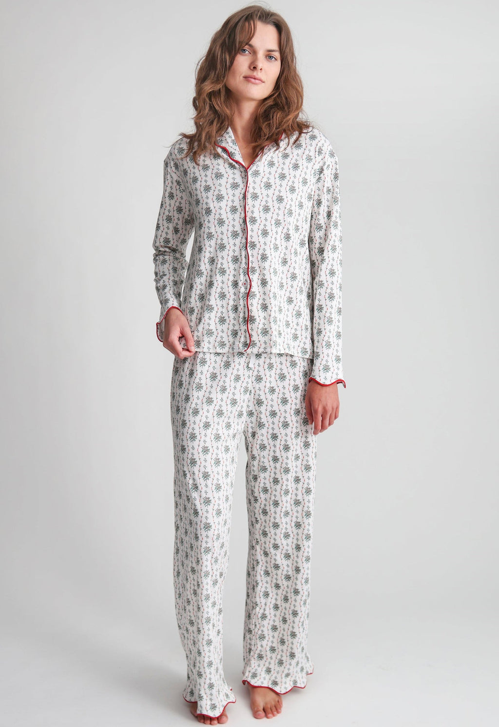 Full-length view of Holly women’s white printed button-front pajama set in a relaxed fit with red piping and scalloped hems