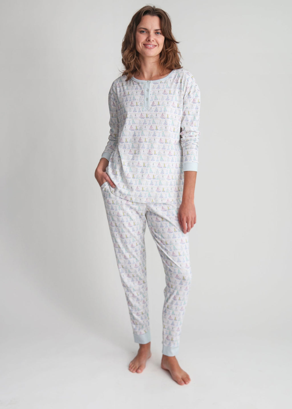 Full-length view of Holiday Harbor Women’s Henley Pajama Set showcasing the sailboat print and long-sleeve fit on a model against a light gray background