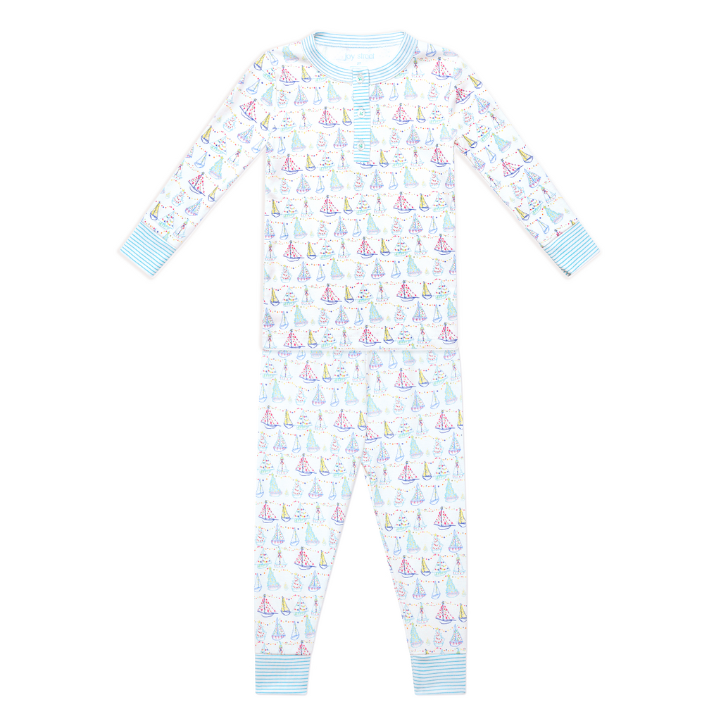 Front view of Holiday Harbor Henley Pajamas showcasing hand-drawn sailboat print with a white background