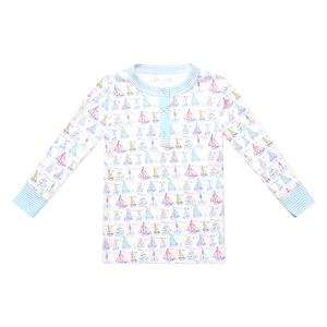 Front view of Holiday Harbor Henley Pajamas top showcasing a sailboat holiday print on a white background