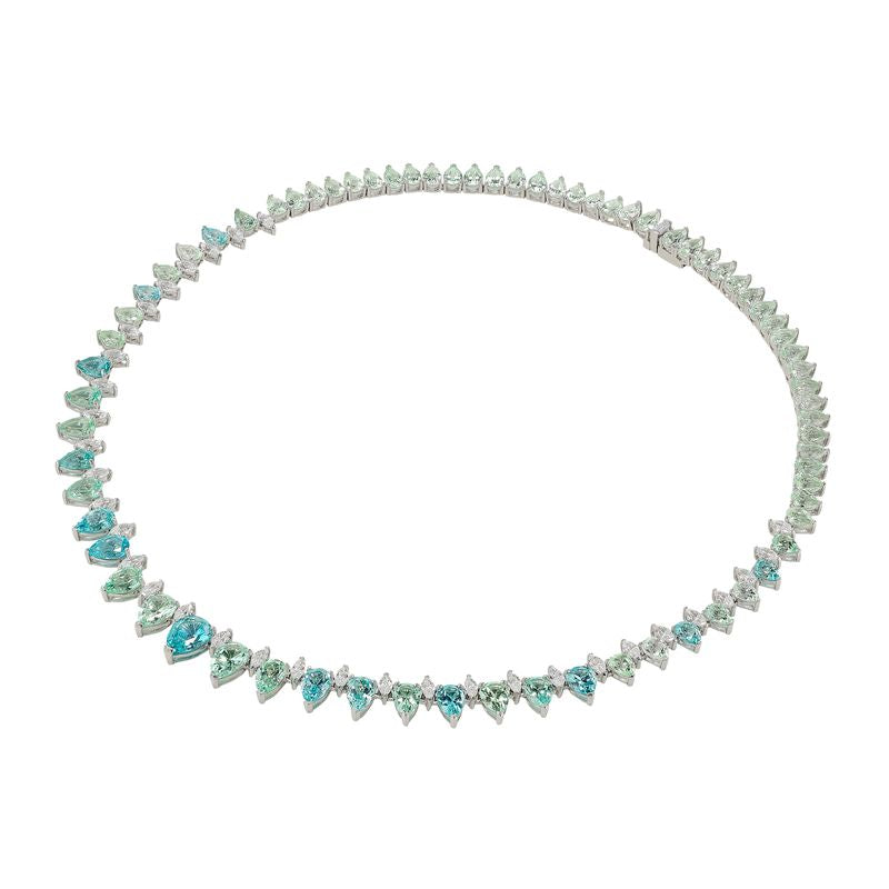 Front view of Ocean Sapphire Infinity Necklace showcasing graduating pear-cut blue and green sapphires on white background