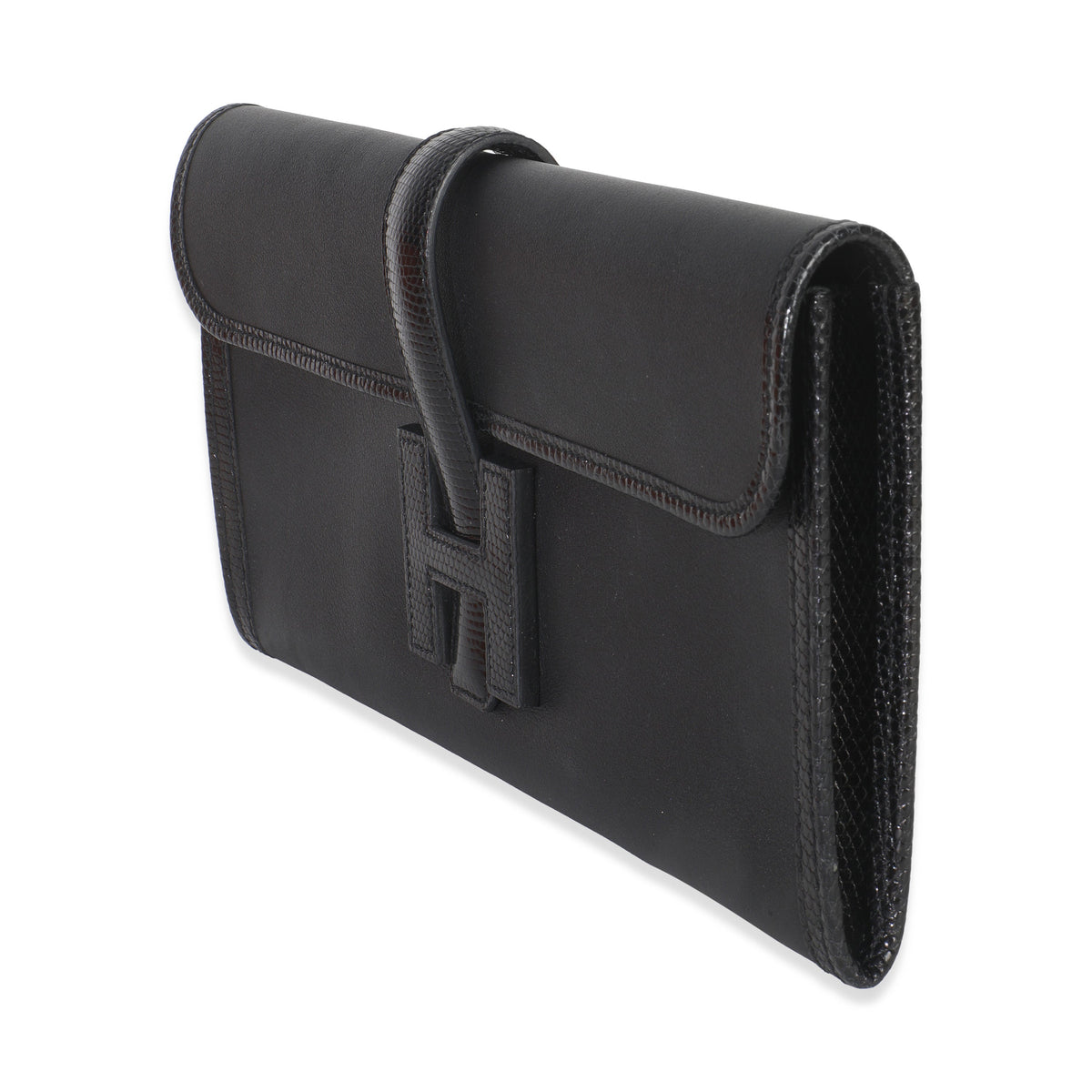 Angled view of Hermès Jige Elan 29 clutch showcasing black Swift leather and lizard-textured flap on white background