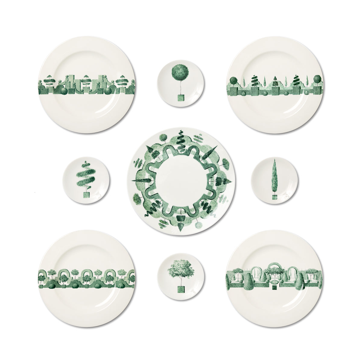 Top view of Jardin á L’Italienne dinner plates showcasing green topiary and architectural band pattern on white background