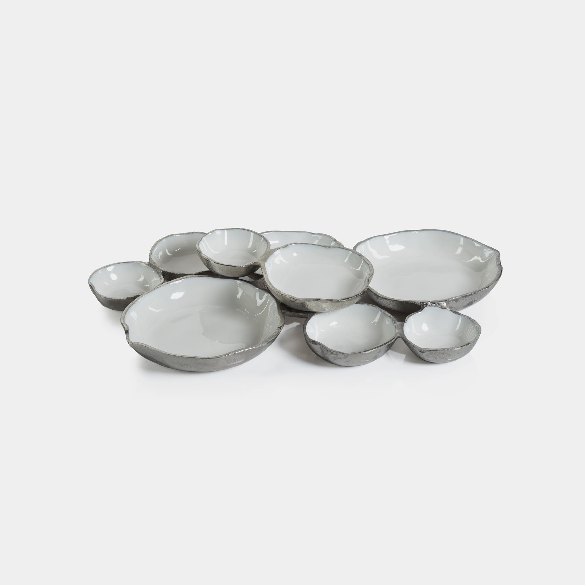 Cluster of Nine Round Serving Bowls in Nickel and White