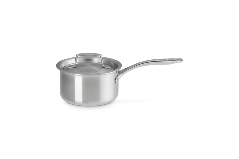 Three-quarter view of Essential Stainless Steel Saucepan, 2 qt showcasing its lid and long handle on a plain background