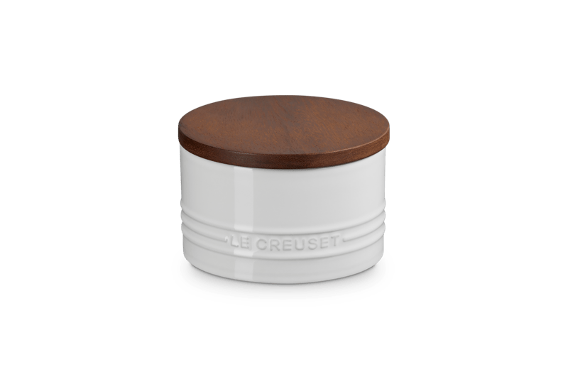 Front view of Signature Storage Canister 16 oz showcasing white enamel body, embossed logo, and wood lid