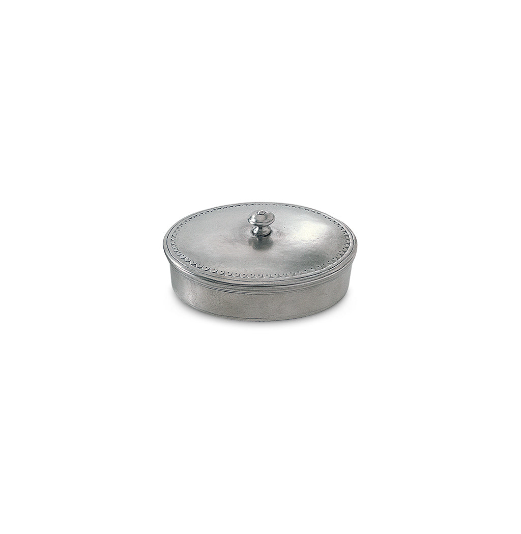 Three-quarter view of Oval Lidded Box, Medium showcasing its domed lid, finial, and decorative rim on a white background