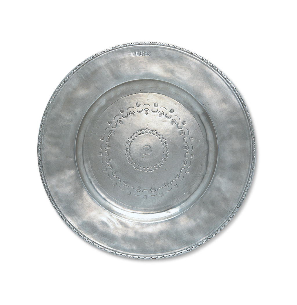 Top view of Engraved Round Platter, Large showcasing engraved circular designs and a scalloped rim against a white background