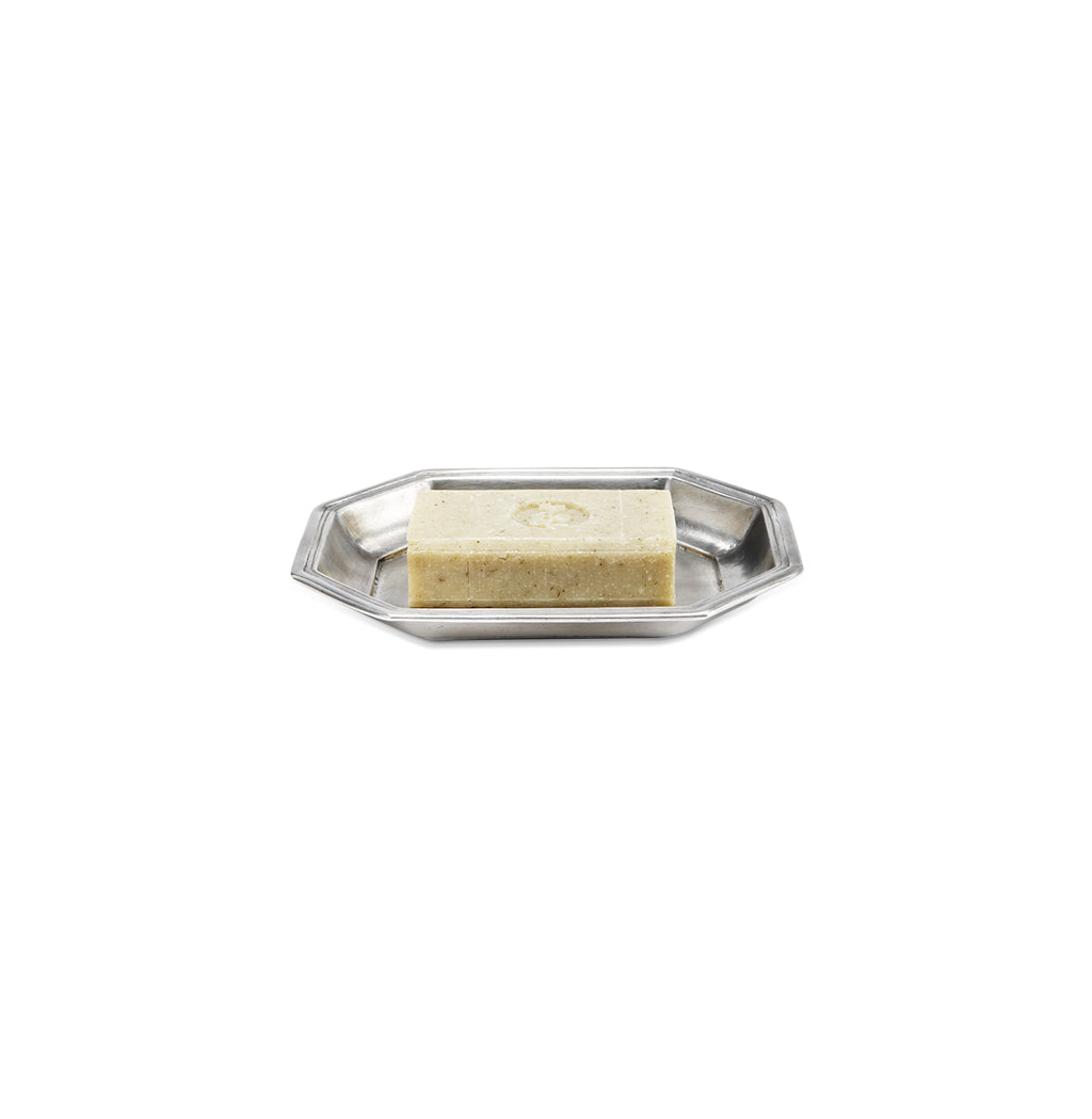 Angled view of Dolomiti Soap Dish showcasing its raised octagonal rim with a soap bar on a white background