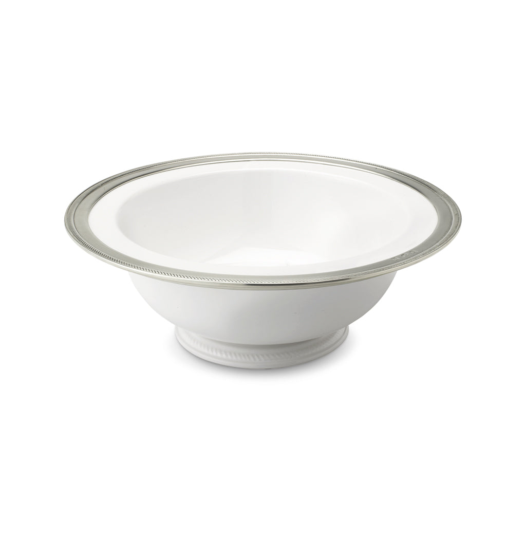 Three quarter view of Luisa Round Footed Serving Bowl, Large with ceramic and Italian pewter rope bordered rim