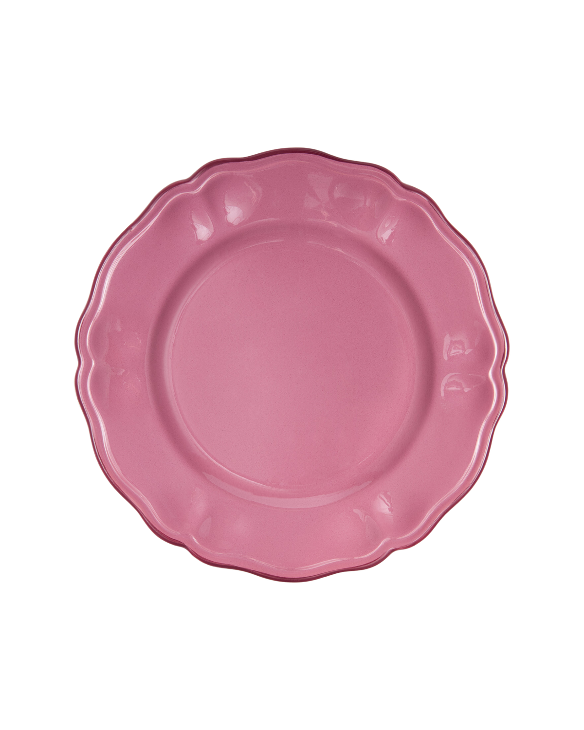 Overhead view of Britwell Dinner Plate showcasing its blush pink ceramic and scalloped rim with a black background