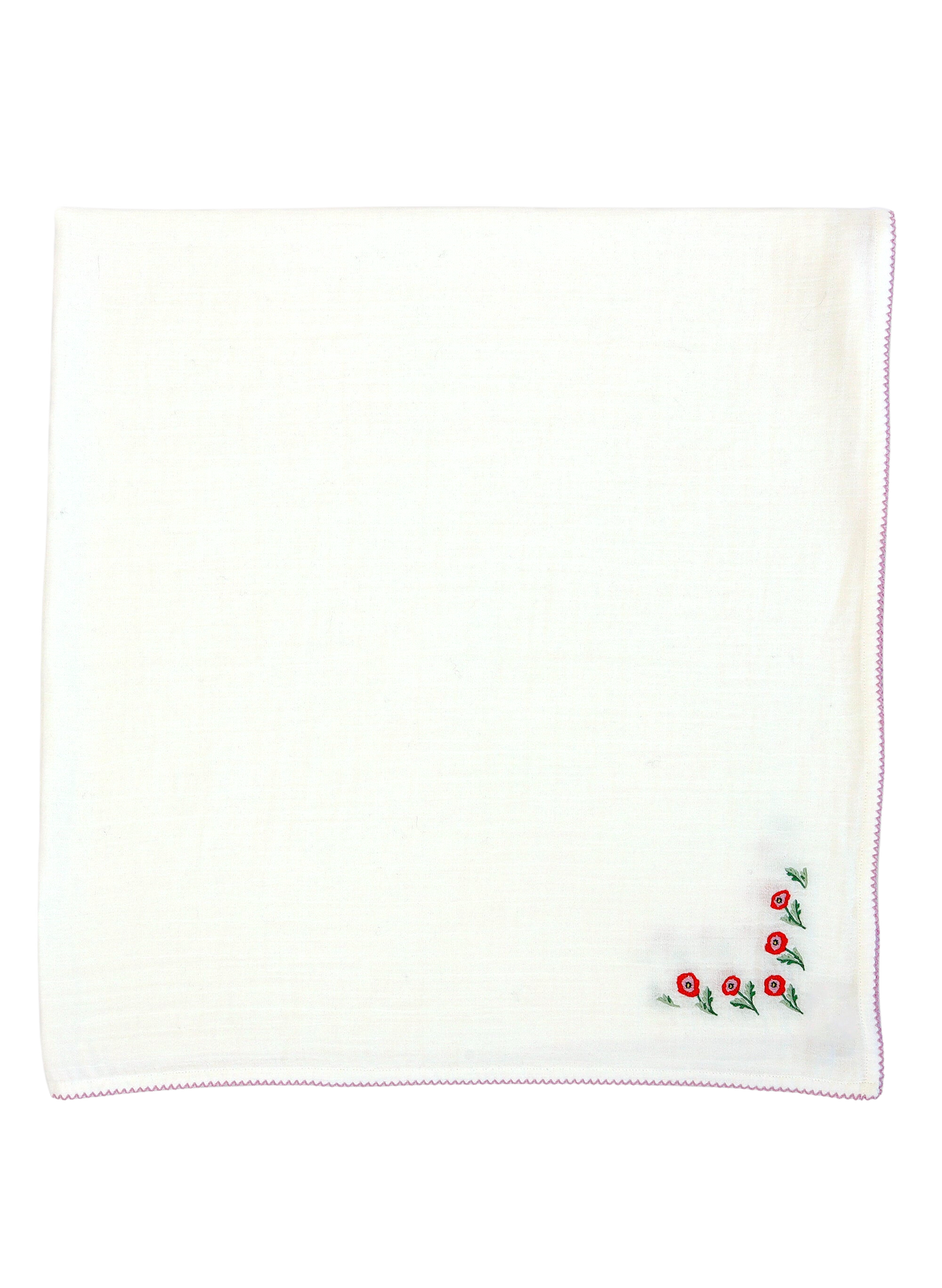 flat lay of Poppy Embroidered Shawl Blanket showcasing corner red poppy embroidery and pink scalloped edge on white background