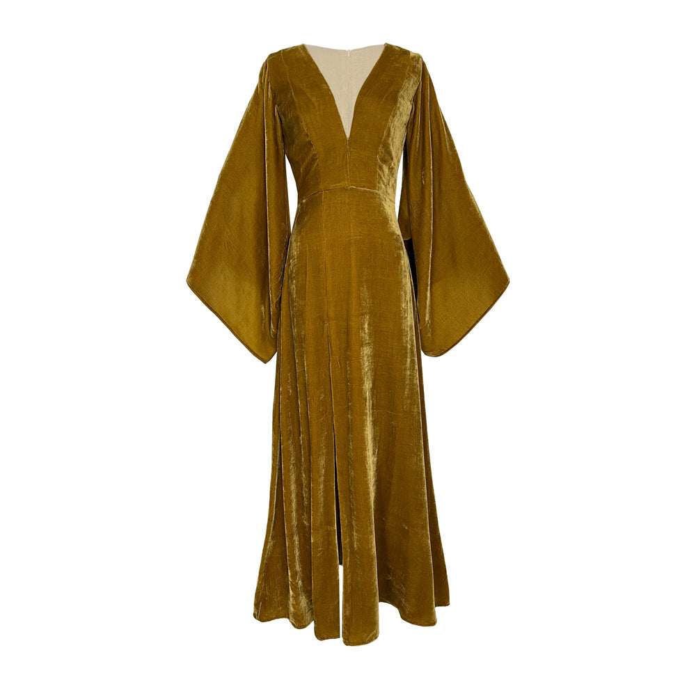 Front view of mustard silk velvet Aladdin Velvet Dress with deep neckline, wide sleeves, and cinched waist