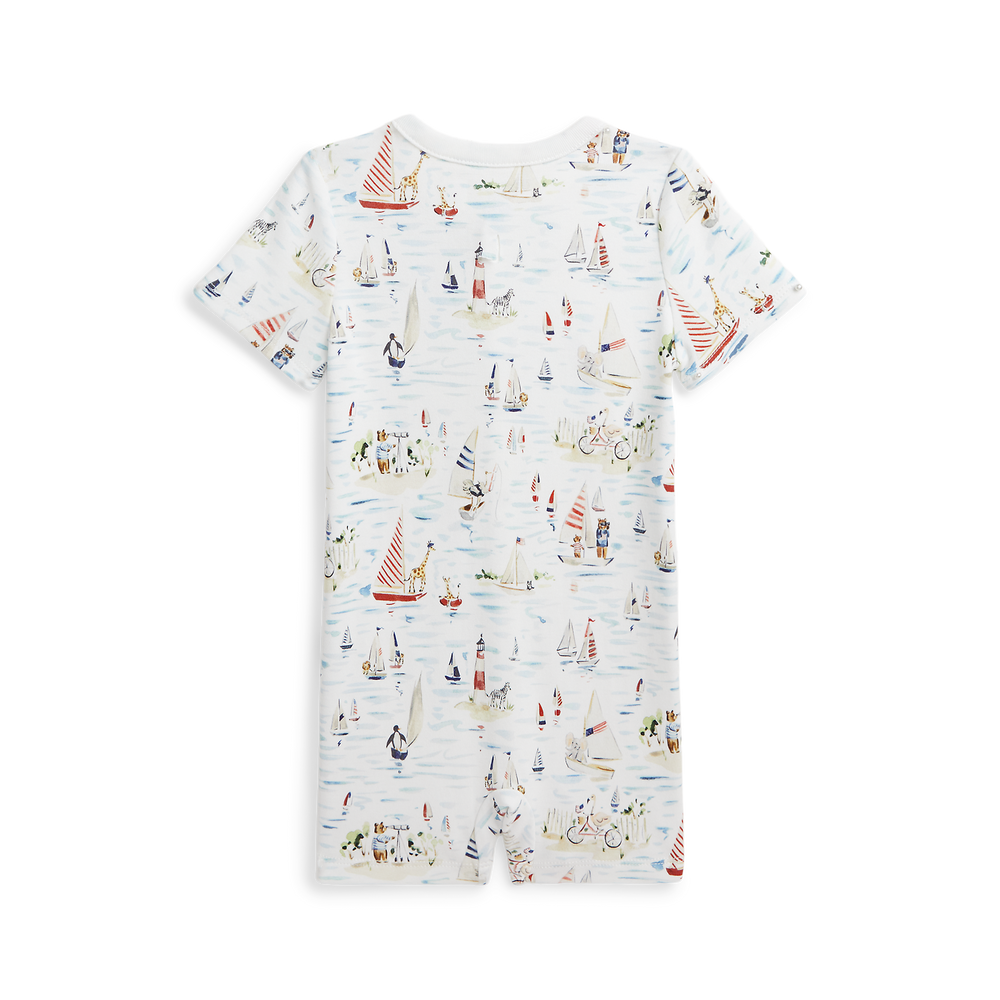 Back view of RL Baby x Riley Sheehey cotton shortall with nautical sailboat print, short sleeves, snap crotch on black