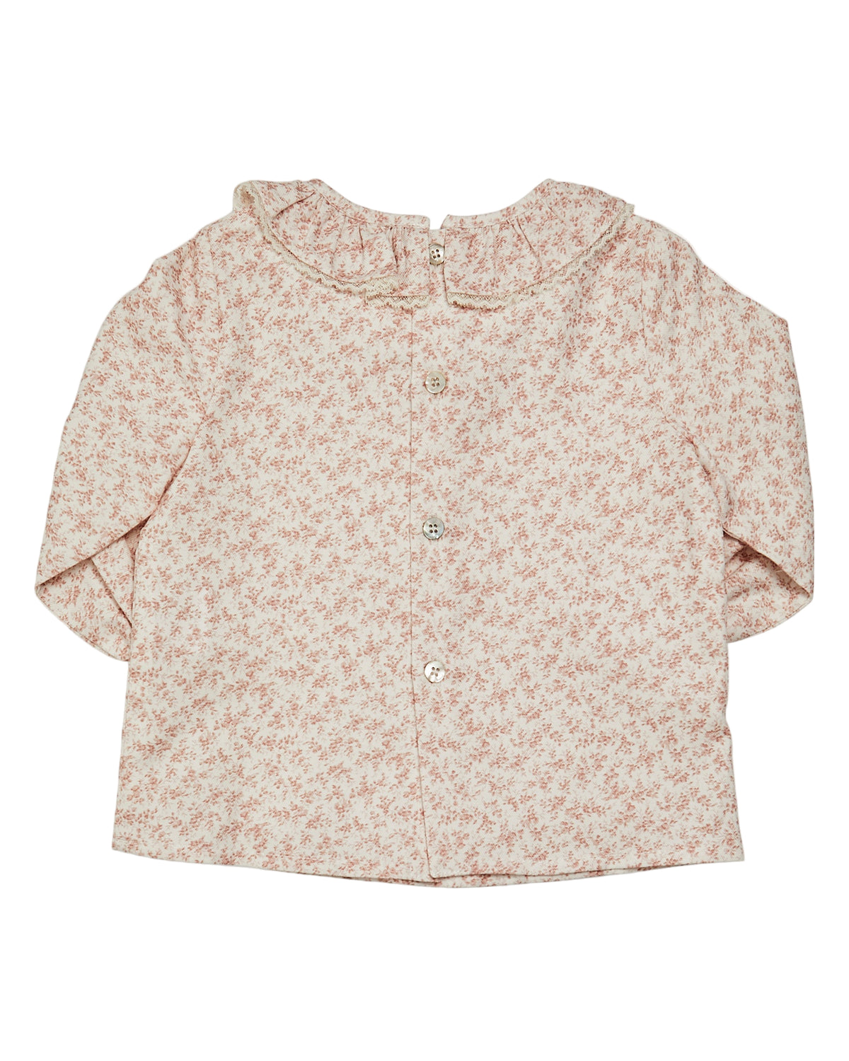 Floral patterned baby shirt on a white background