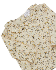 Floral-patterned shirt with a visible brand label on a white background