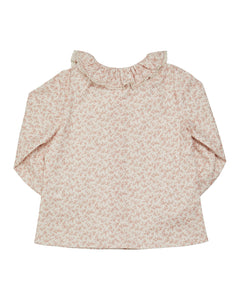 Floral patterned blouse on a white background