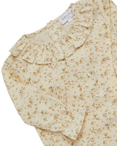 Floral blouse with ruffled sleeves on a white background