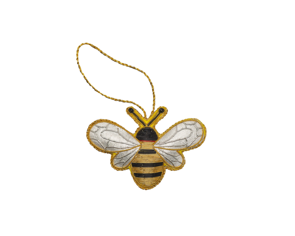 Front view of Bumble Bee Ornament showcasing beaded metallic thread on velveteen fabric with a black background