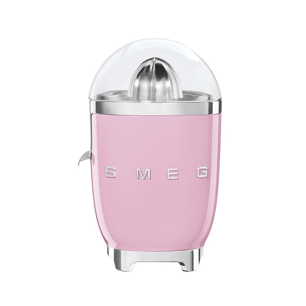 Front view of SMEG citrus juicer in pink showcasing stainless-steel reamer, clear dome, chrome accents on white background